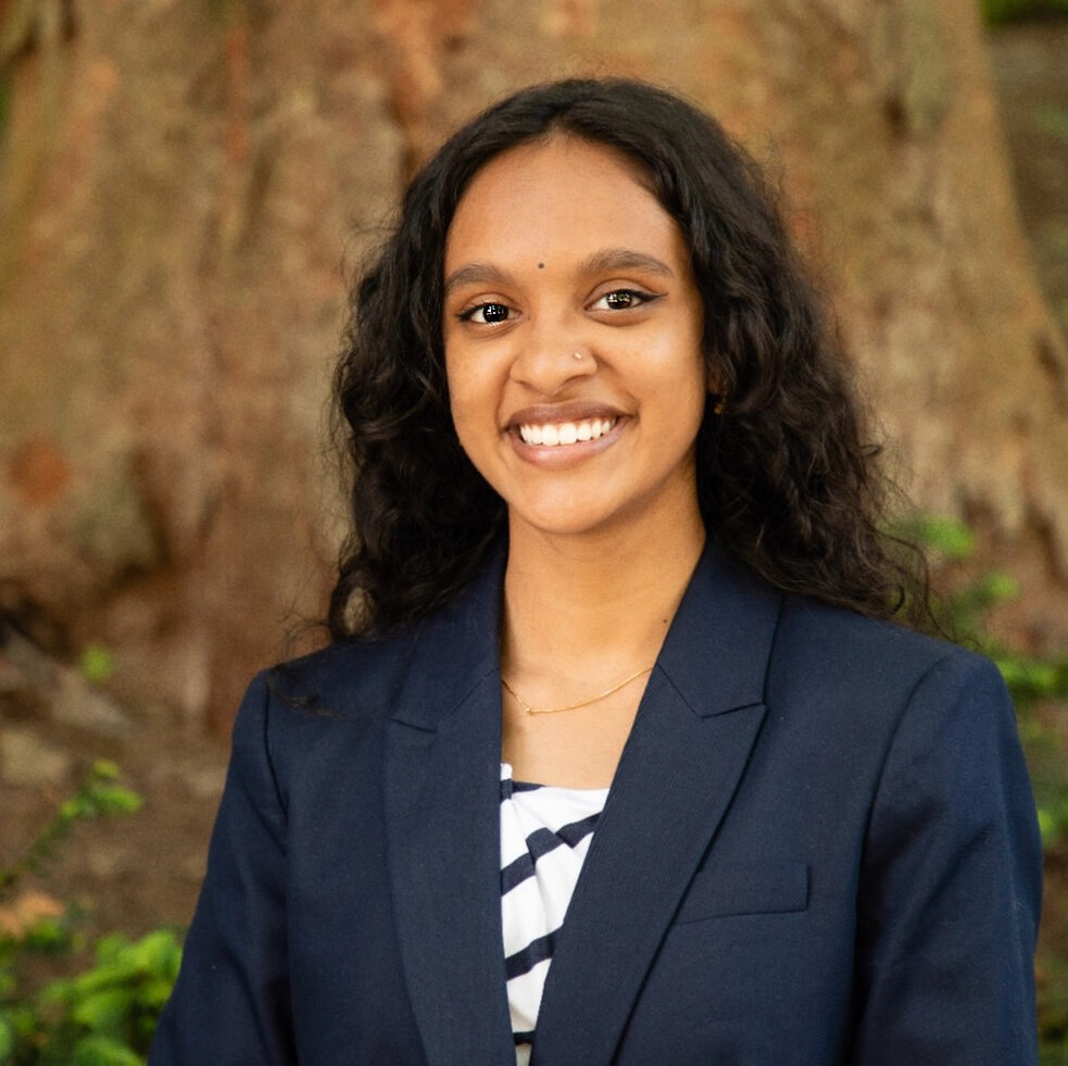 Vunnathi Ankem outdoors wearing a dark blue blazer.