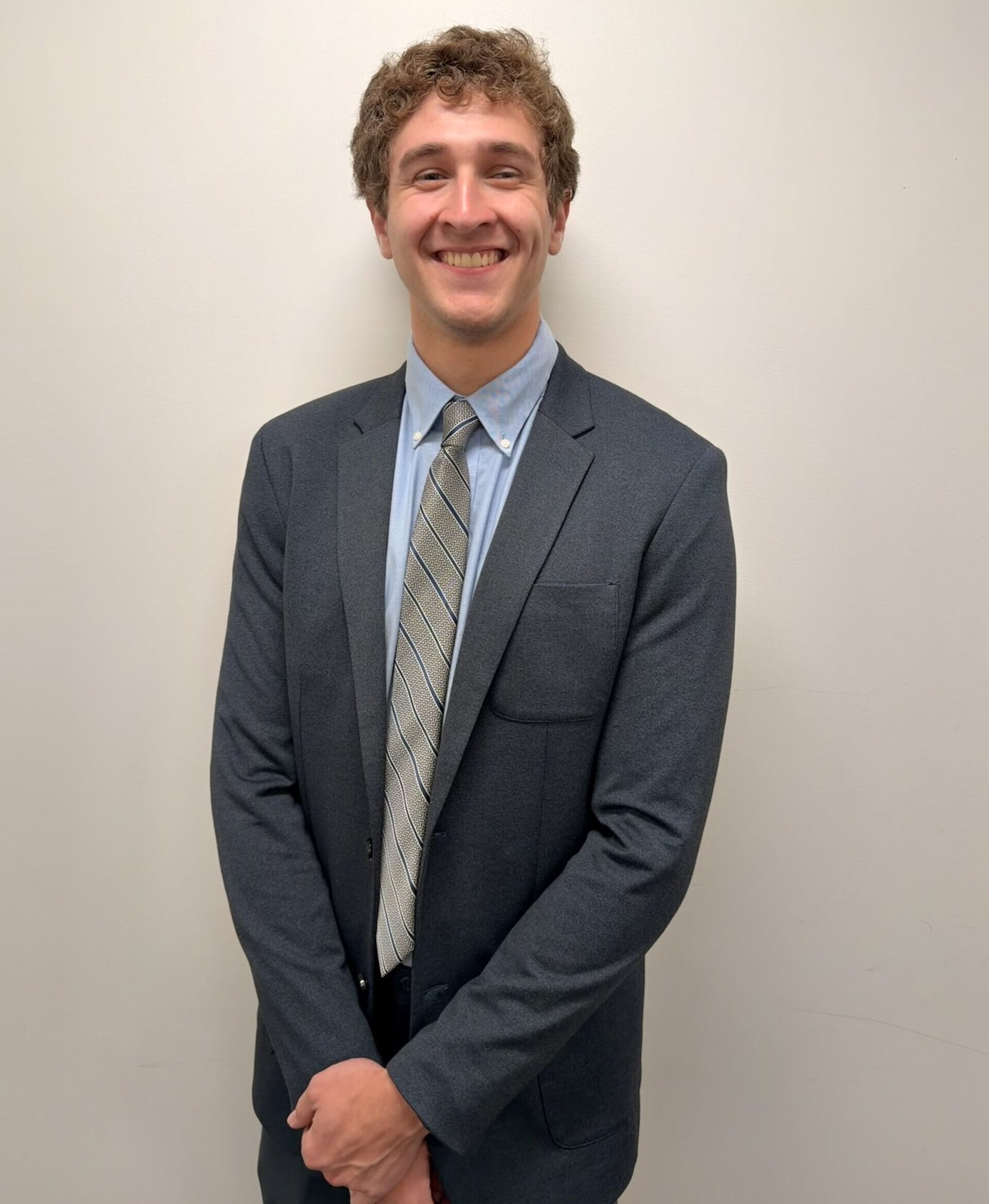 Ryan Van Dyke in a dark suit and tie.