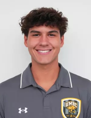 Ryan Calheira wearing a silver polo shirt.
